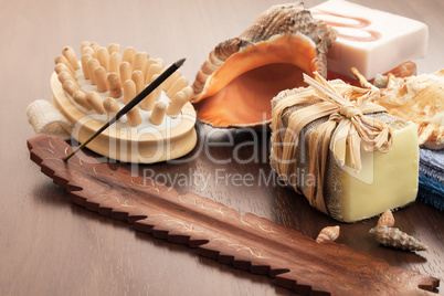 bath and spa accessories on brown wooden background