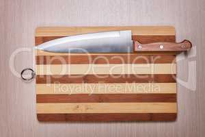 big knife and cutting board on the table