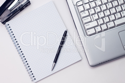 blank notepad and laptop in the office