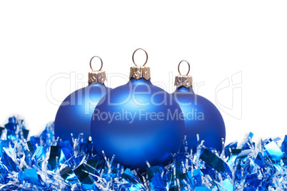 blue christmas balls with tinsel isolated on white