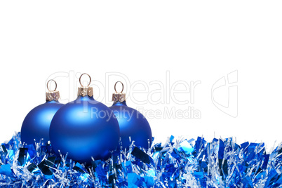 christmas balls with tinsel isolated over white background