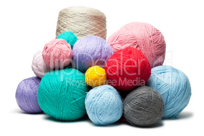 colorful balls of woollen threads isolated over white