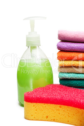 colorful towels, liquid soap and shower sponge isolated over whi