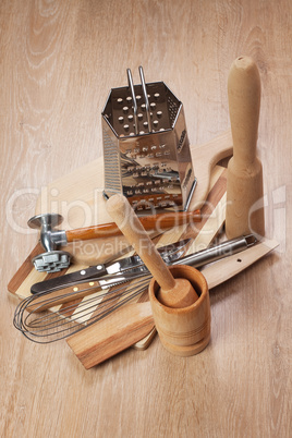different kitchen tools on the wooden table