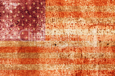 faded american flag on rusted metal