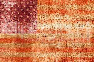 faded american flag on rusted metal