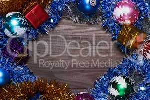 gifts and christmas decoration over wooden background