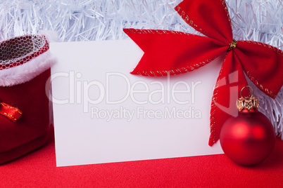 greeting card and christmas decoration on the red background