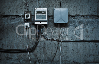 grunge technological background with cables and devices on the w