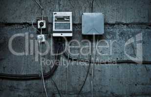 grunge technological background with cables and devices on the w
