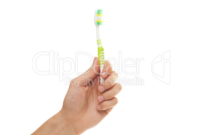 hand with green tooth brushe isolated over white background