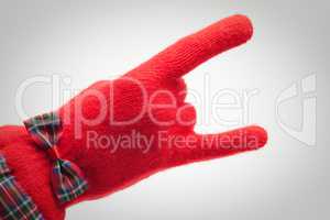 hand in red glove over grey background
