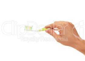 hand with toothbrush isolated over white background