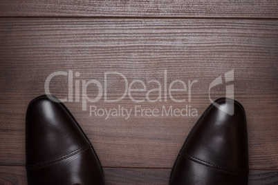 man standing on the wooden floor background