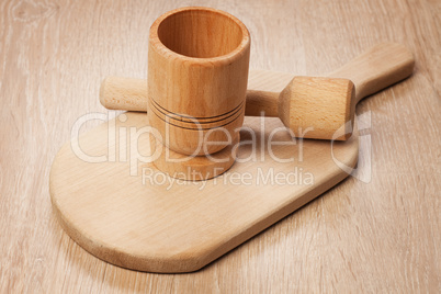 mortar and breadboard on the wooden table