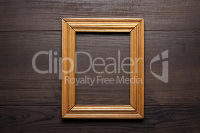 old empty frame over wooden background