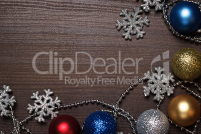 shiny christmas decoration on brown wooden background