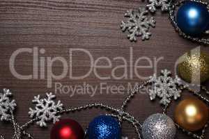shiny christmas decoration on brown wooden background