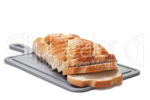 sliced bread on breadboard isolated