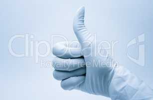 surgeon hand with thumb up after the successful surgery