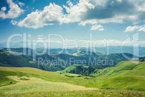 summer mountains green grass and blue sky landscape