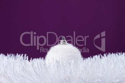 white christmas decoration over purple background