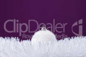 white christmas decoration over purple background