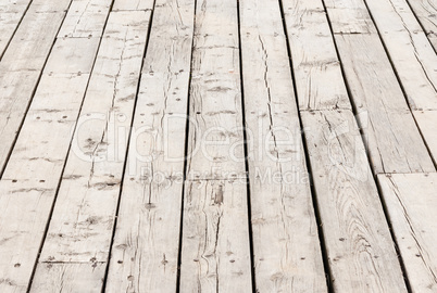 Cracked weathered wood deck boards