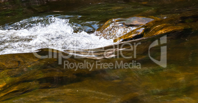 Abstract smooth and splashing river water