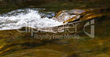 Abstract smooth and splashing river water