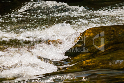 Flowing and splashing river water