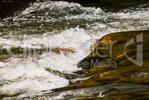 Flowing and splashing river water