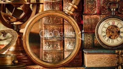 Vintage antique pocket watch against the background of old books