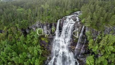 Aerial footage from Tvindefossen waterfall from the bird's-eye view, Norway