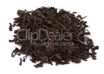 dry black tea leaves isolated on white