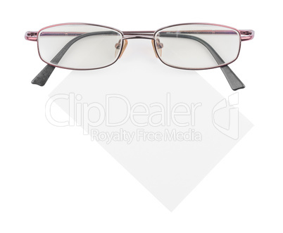 Glasses and blank paper isolated on white background