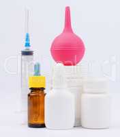 Bottles of medicine, enema and syringe injection