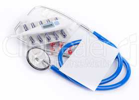 Stethoscope and pills with an electronic thermometer