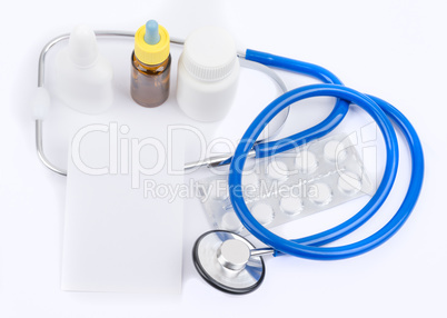 Stethoscope with medicine and a white sheet for recipes