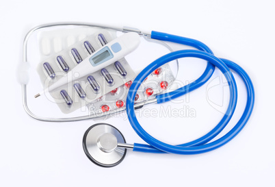 Stethoscope and pills with an electronic thermometer