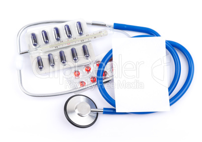 Stethoscope and pills with thermometer