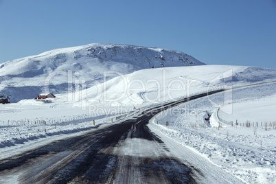 Snowy road in wintertime