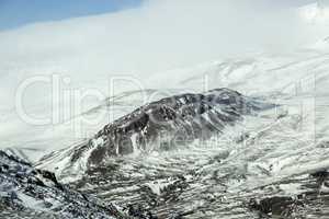 Snow-covered volcanic mountain landscape in Iceland