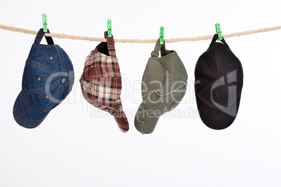 Four Caps On A Clothesline