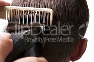 man getting a haircut by a hairdresser.