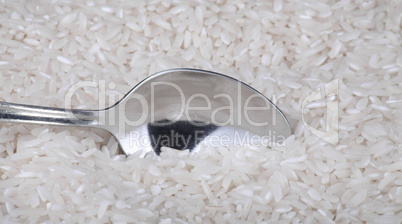 rice background and teaspoon