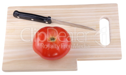 wood kitchen board with knife and tomato
