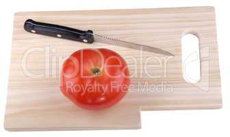 wood kitchen board with knife and tomato