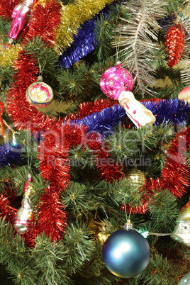 many of toys on green christmas fir