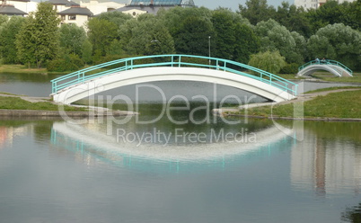 bridge over pond in city park